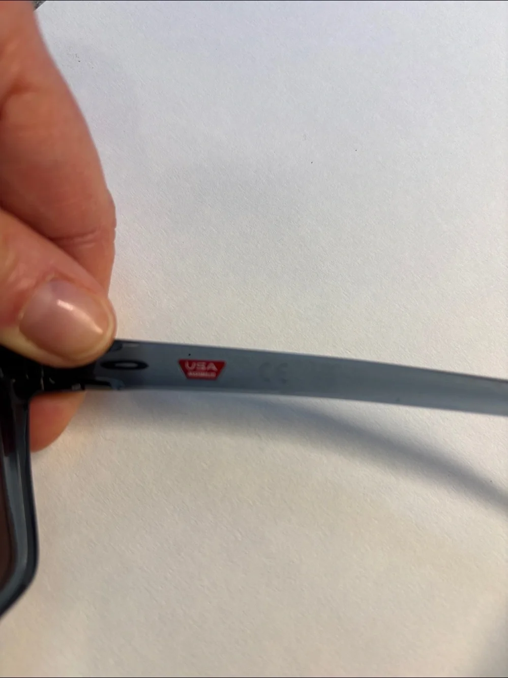 Oakley Sunglasses - Translucent Smoke Frame with Rose Mirror Lenses